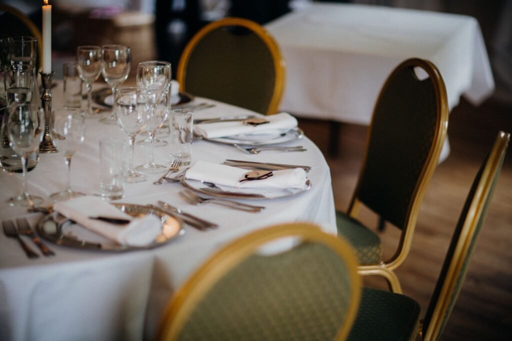 A beautifully arranged dining table with elegant glassware and tableware, perfect for special events.