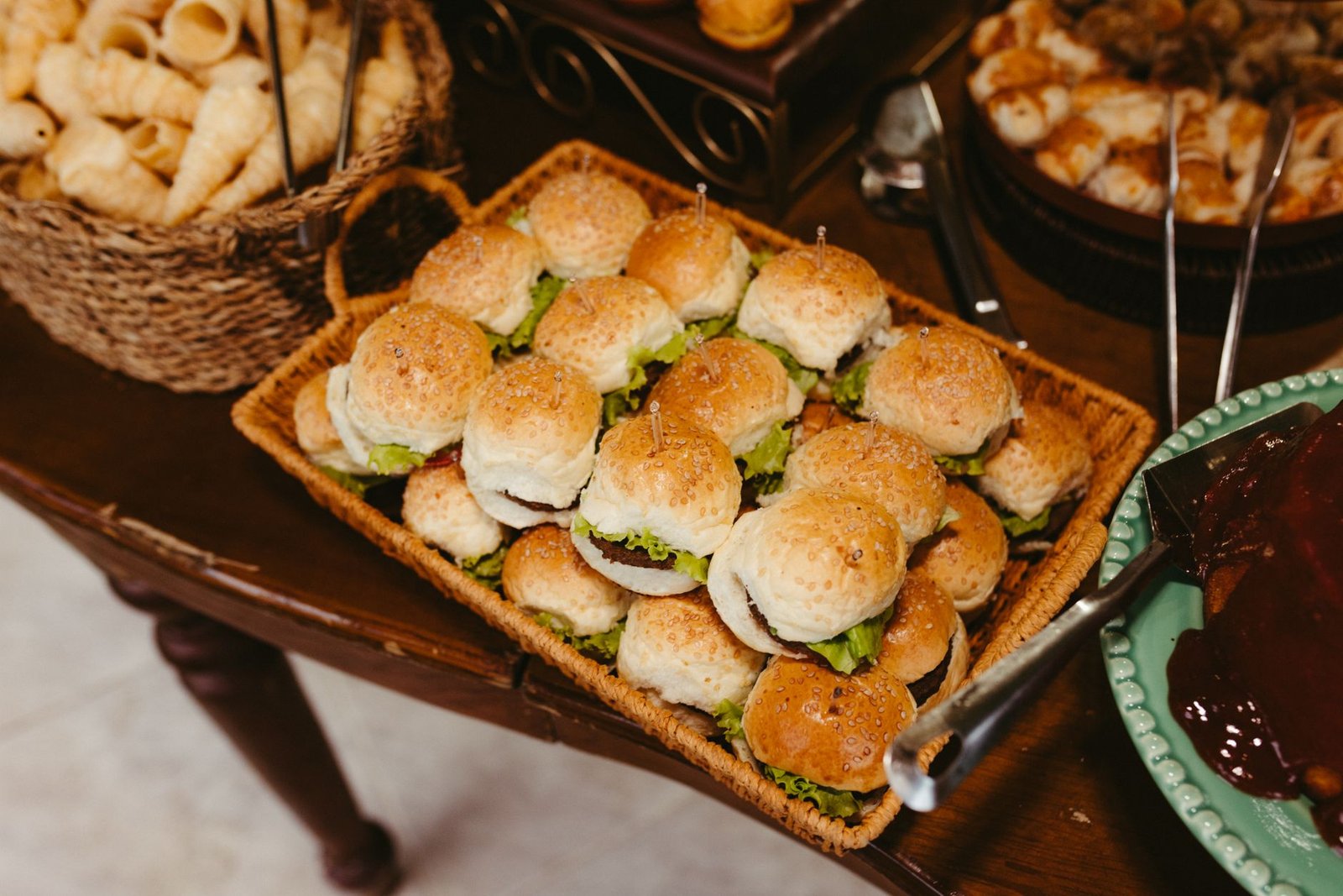 A close-up of assorted mini sliders on a platter, perfect for party events or catering setups.