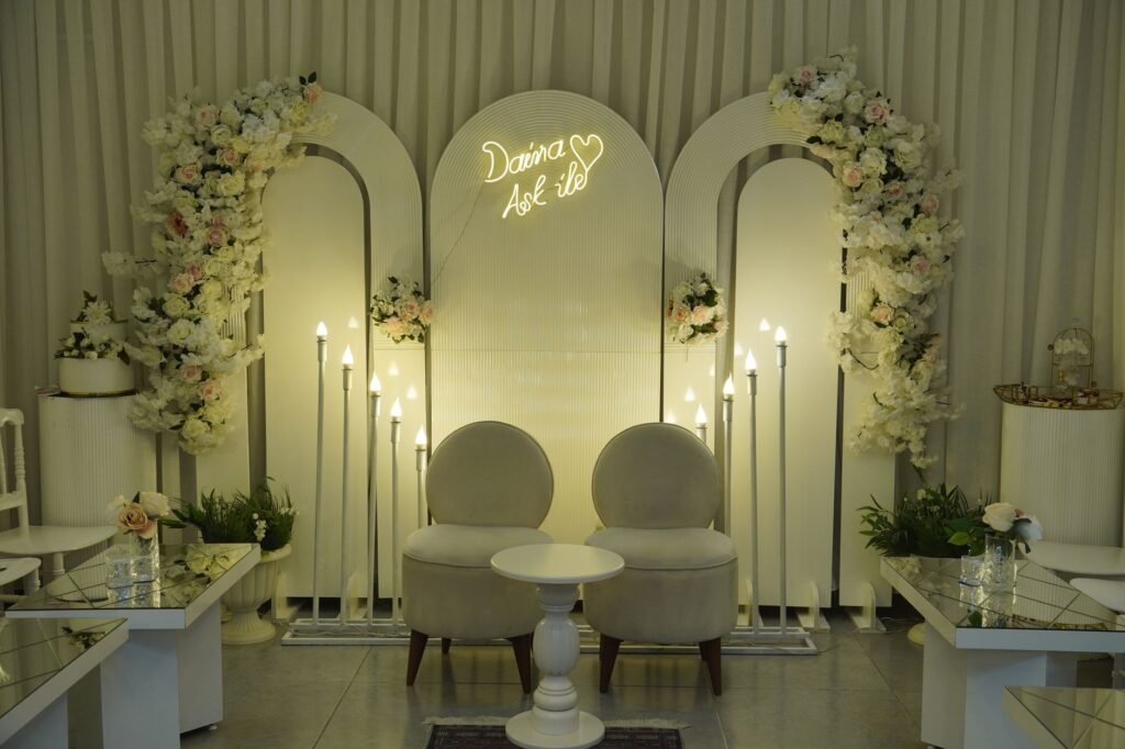 Sophisticated wedding ceremony setup with floral arrangements and elegant lighting.