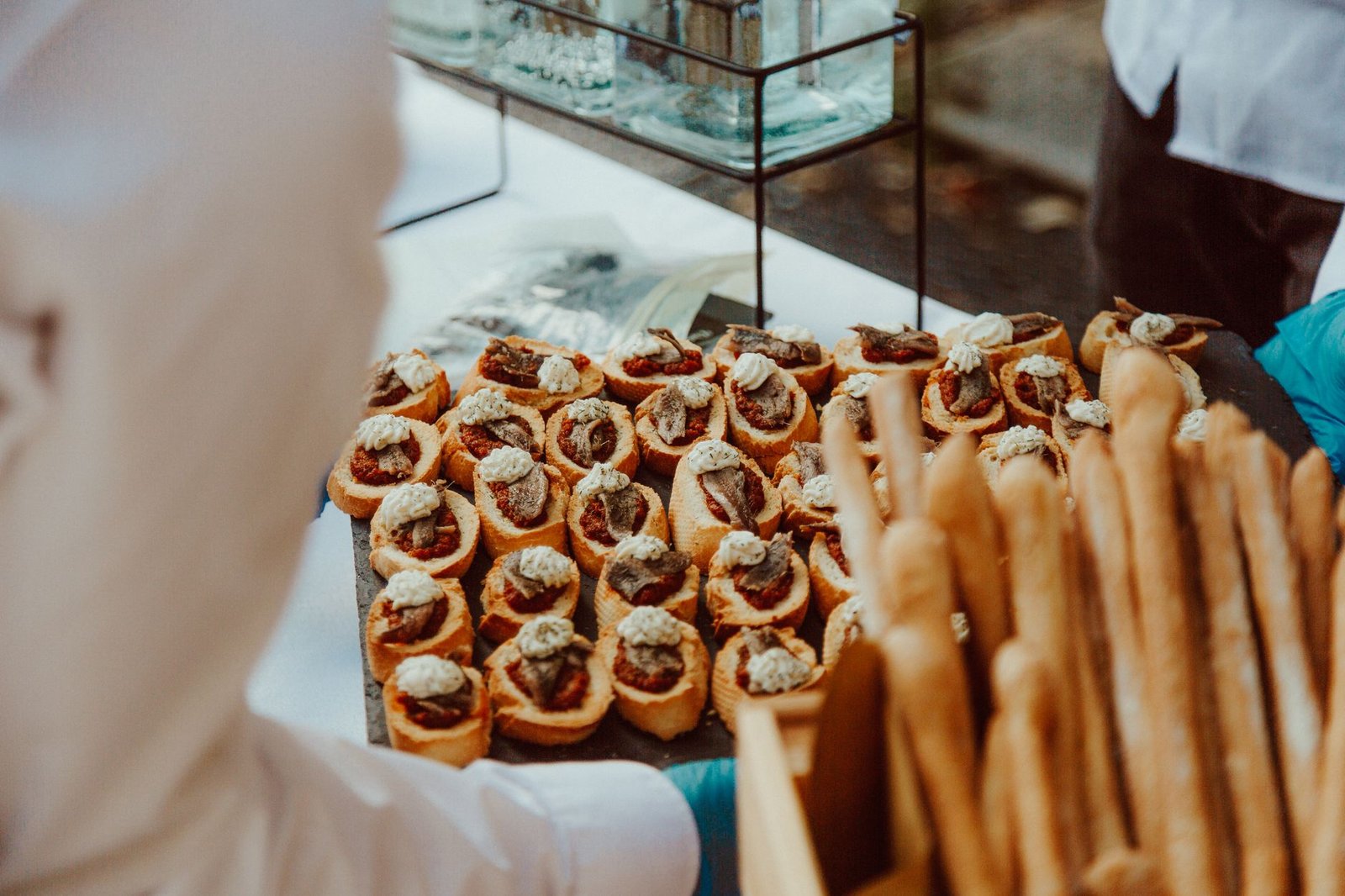 A selection of gourmet appetizers elegantly presented at an outdoor catering event, ideal for culinary themes.