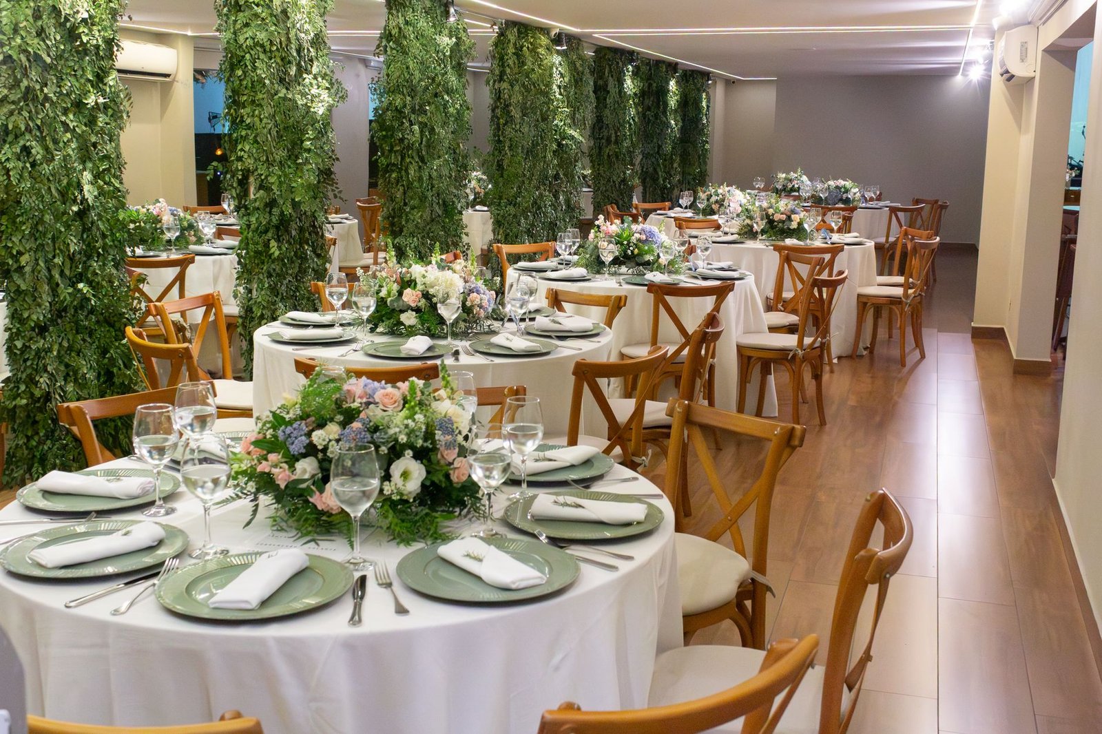 Charming wedding venue with floral arrangements and elegant seating in São Paulo, Brazil.