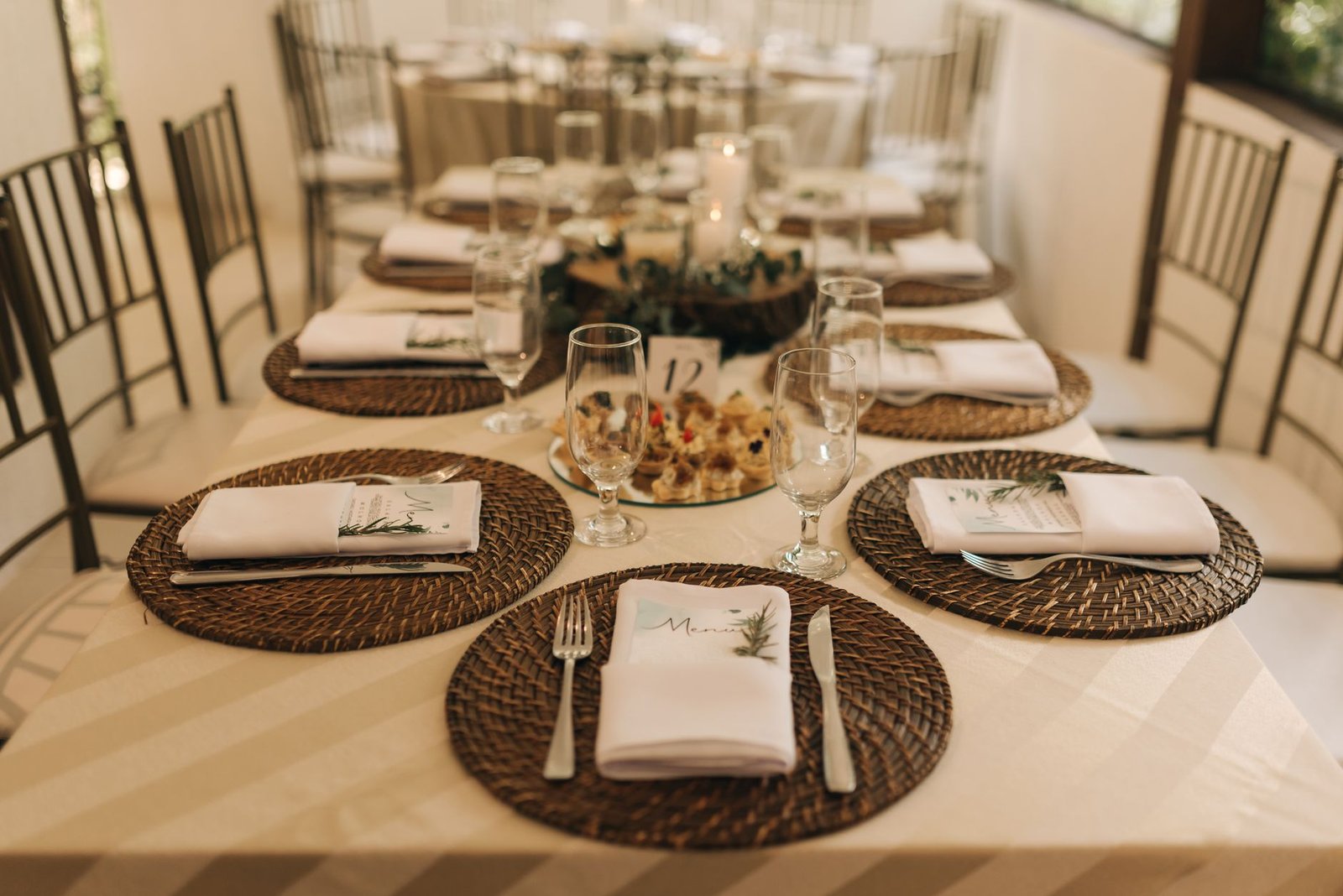 Beautifully arranged table setting at a wedding reception with elegant decor and place settings.