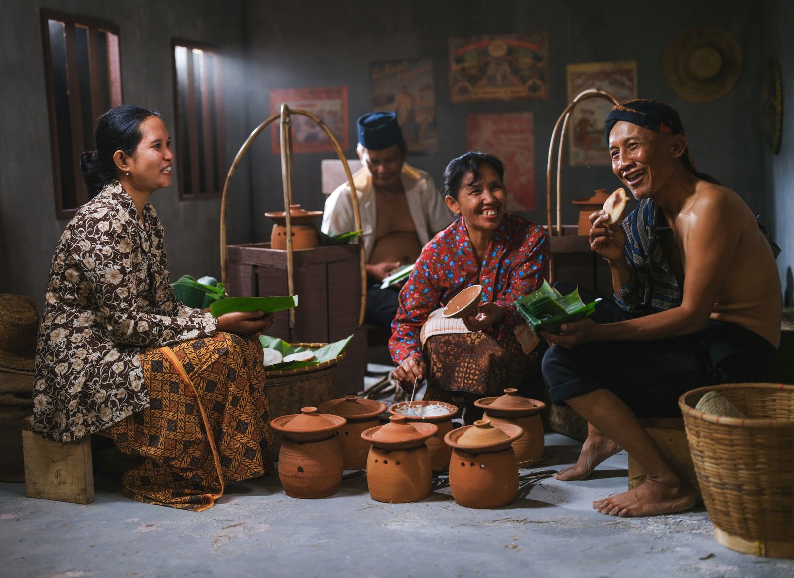 Javanese family enjoying traditional cuisine indoors, showcasing Indonesia's cultural heritage.
