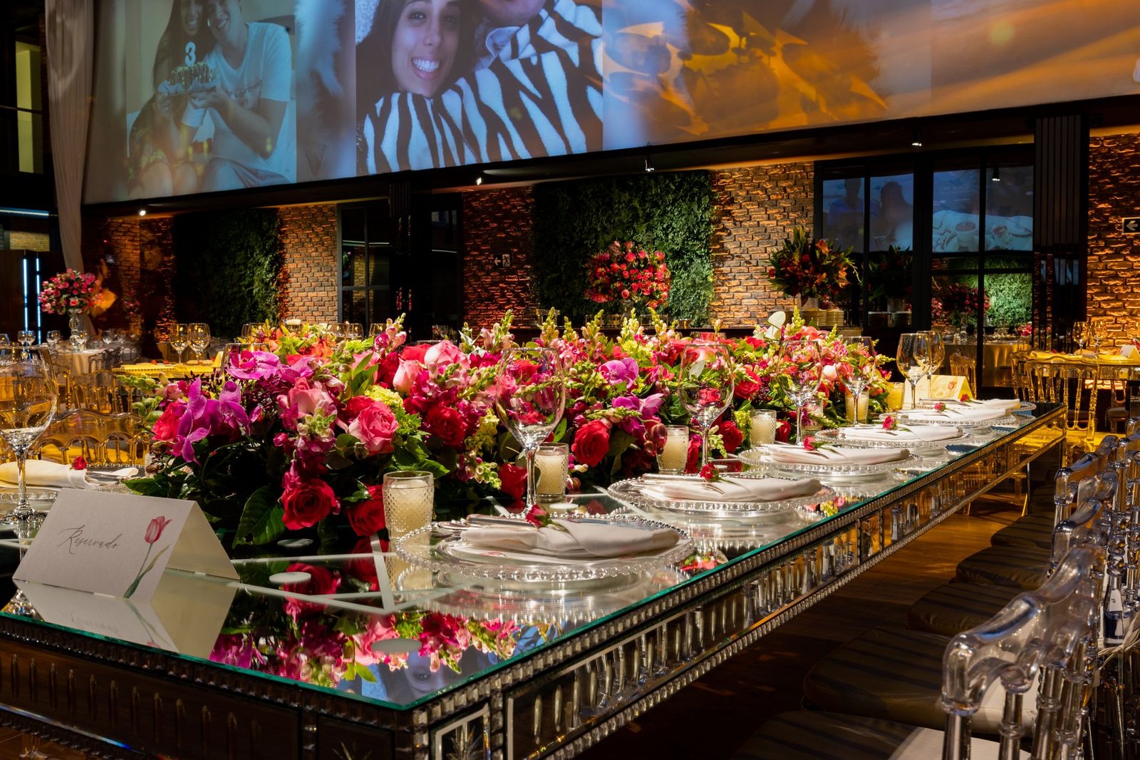 Luxurious table setting with vibrant pink flowers in a modern, elegant venue.